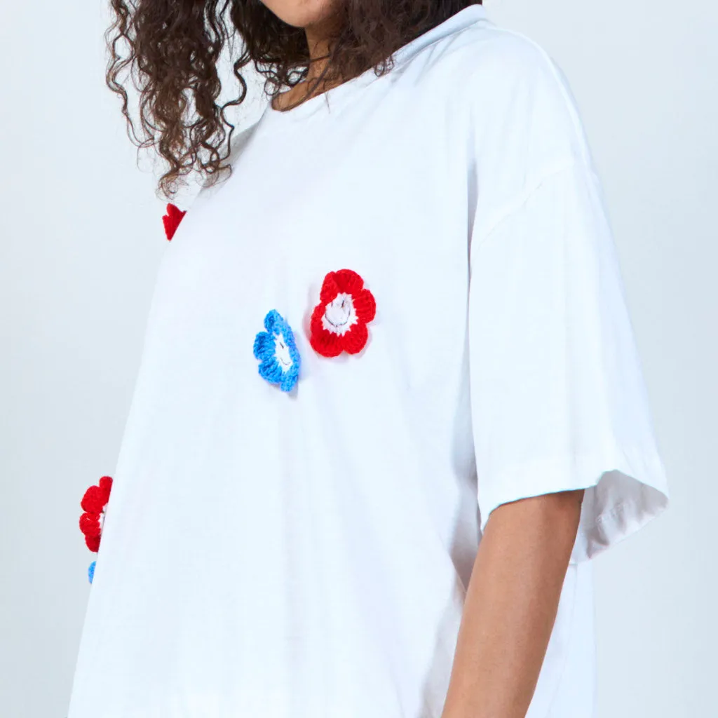 White t-shirt with crochet flower accents wholesale